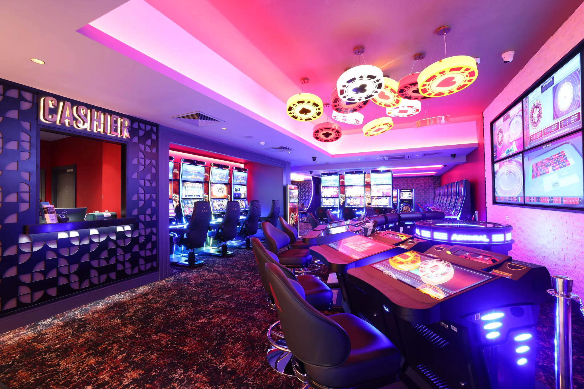 Slot machines on the gaming floor under warm lighting